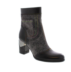 Experience the ultimate fusion of edgy and chic with L'Artist Milani boots. These versatile and trendy booties elevate any outfit for a night out or a stylish street look. With a fun and fashionable design, you can make a statement while staying comfortable.