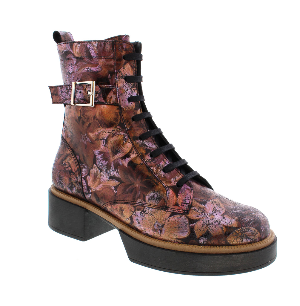 Meet your new go-to black boot that perfectly blends style and comfort. Featuring an easy side zipper, this orthotics-friendly design ensures a hassle-free slip-on experience. The block heel adds subtle height while keeping every step light and supported, making it ideal for all-day wear. Embrace fashionable support without compromise.