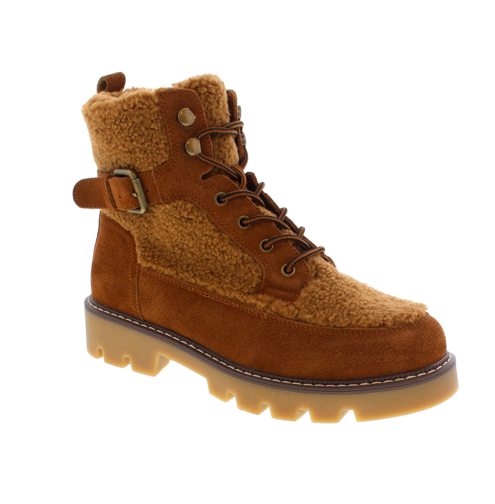 Combine rugged durability with cozy comfort in the Spring Step Namiko bootie. Crafted with a plush sherpa exterior and suede panels, this camel-toned bootie offers a chic, winter-ready style. The inside zipper ensures easy wear, while the soft sherpa and faux fur lining provide exceptional warmth throughout the day. Contrast stitching on the welt highlights expert craftsmanship, and the sturdy lug sole delivers reliable traction and stability. 