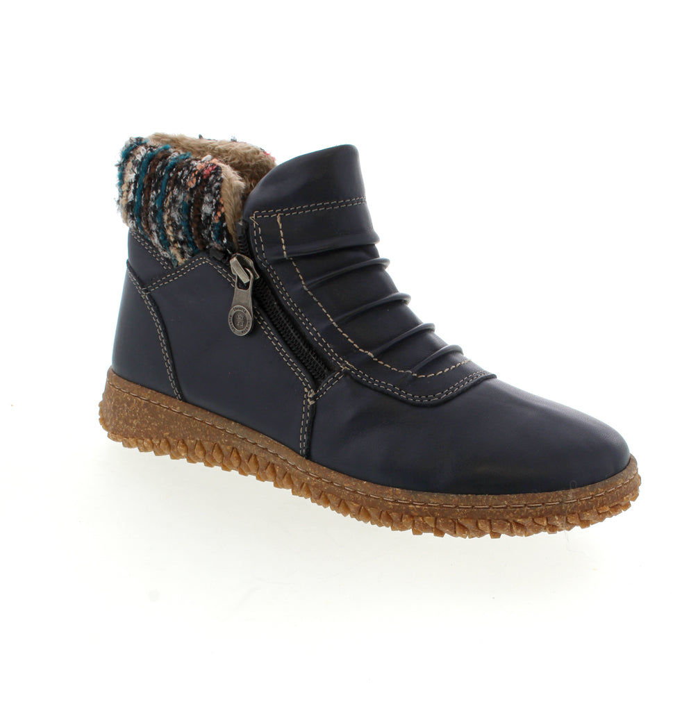 The Volks Walkers Naze in Navy is a sophisticated bootie featuring a durable leather upper combined with a soft faux fur lining for enhanced warmth and comfort. Expertly designed to be orthotic friendly, it accommodates custom supports without compromising fit. This boot offers reliable support and a refined look, perfect for those seeking both function and style in their footwear.