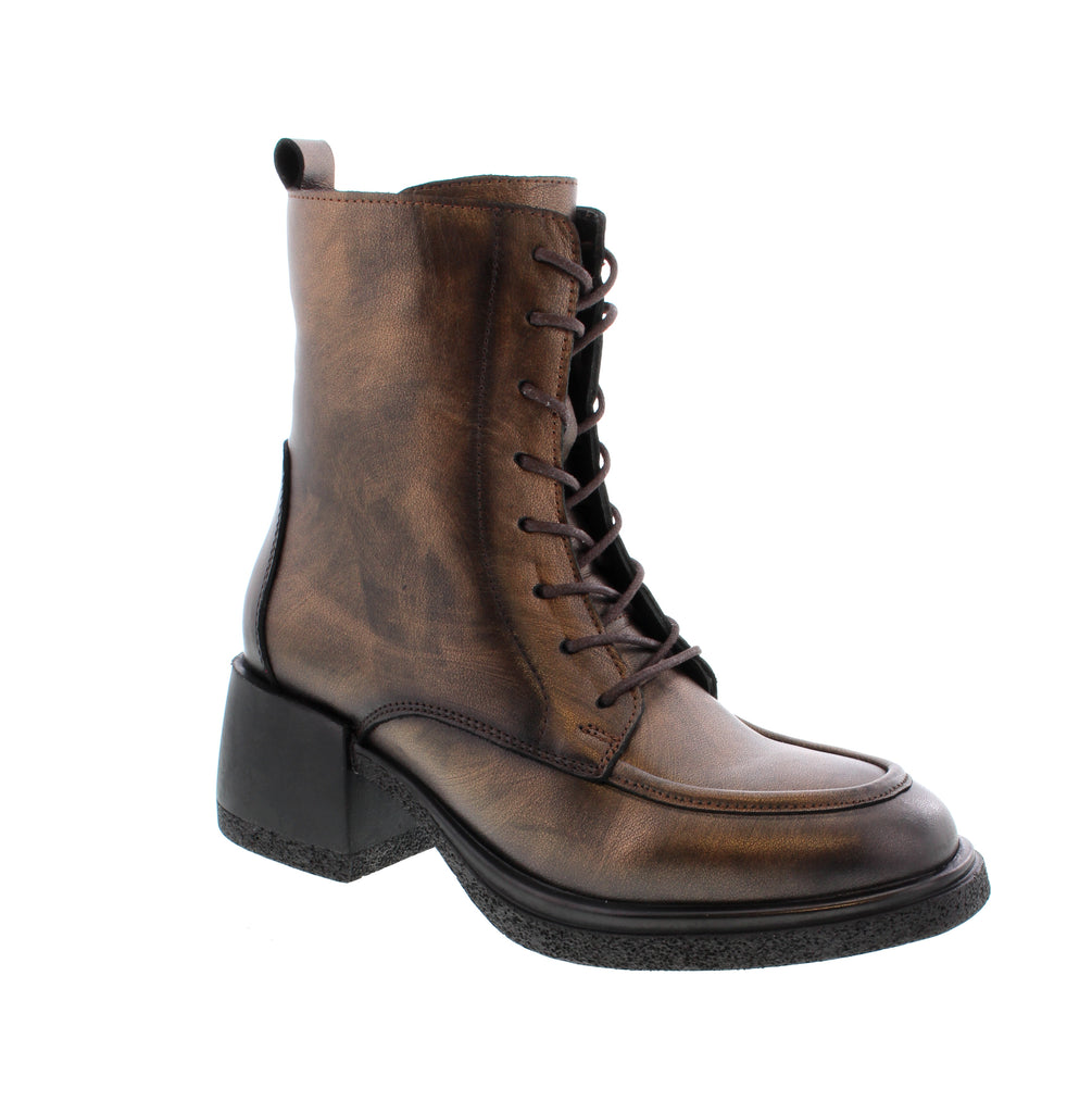 The Anzia Sylvia in brown combines sophisticated style with practical comfort. Featuring a modern block heel and feminine front lacing, this boot elevates any outfit. It's designed with a removable insole to support orthotic use and a convenient side zipper for easy wear, making it an excellent choice for those seeking both elegance and functionality.