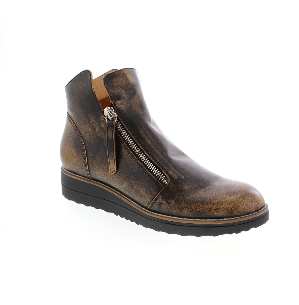 Django &amp; Juliet Oh My-DJ - Black Multi is a versatile ankle bootie that combines style with everyday comfort. Featuring a leather upper with a foam midsole and rubber outsole, this round-toe wedge boot delivers reliable support for casual wear. Leather upper with leather lining and man-made leather footbed provide durability and comfort. Double side zip entry makes it easy to slip on and off