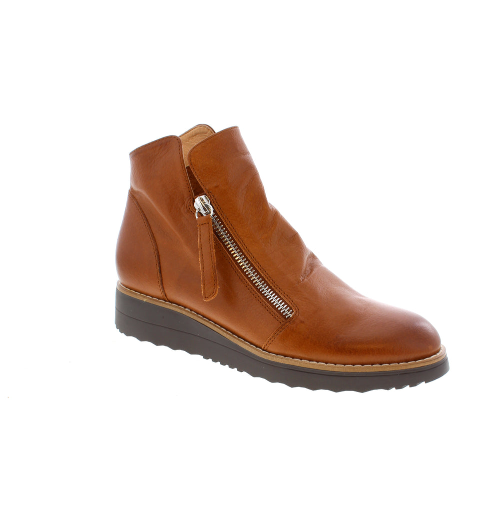 The Oh My Boot from Django &amp; Juliet combines sporty flair with comfort in a stylish bootie. Crafted from the softest leather, this design features a flat wedge sole that provides both support and ease of movement. Its slip-on style is complemented by two convenient zippers, allowing you to put them on and take them off effortlessly. Perfect for everyday wear, these boots offer practicality without sacrificing fashionable appeal.