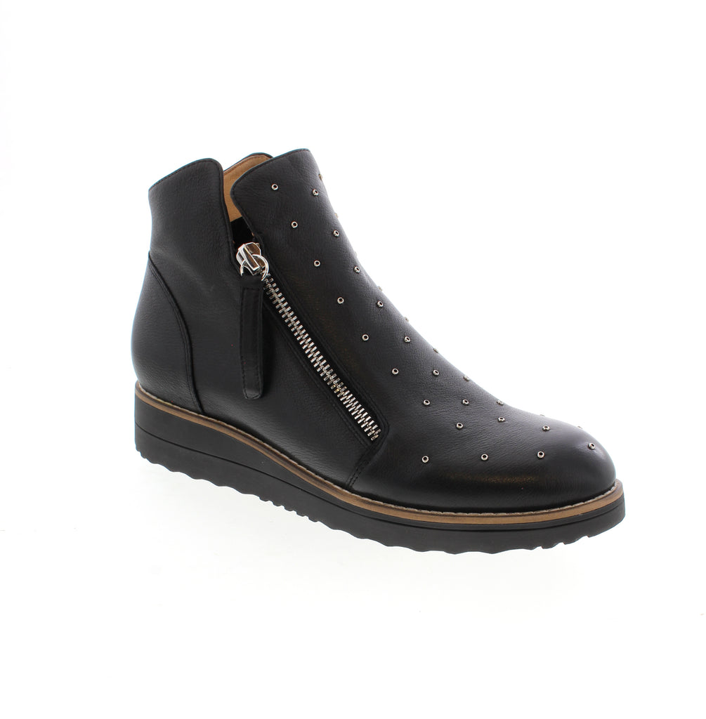 Django &amp; Juliet's Oh Myo-DJ bootie brings edgy sophistication to your everyday rotation. This studded black ankle boot features a leather upper with a comfortable foam midsole and rubber outsole for all-day wear. Leather upper with leather lining and man-made leather footbed provide cushioning and support. Double side zip entry makes it easy to slip on and off. The wedge heel and round toe create a flattering silhouette perfect for casual occasions.