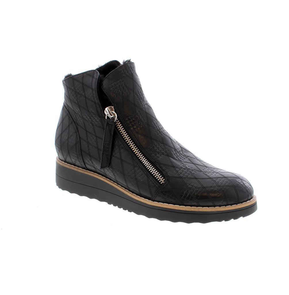 A sporty twist on a bootie - the Opal boot is designed with soft leather, fur lining and a flat wedge sole featuring a slip-on style and two zippers for easy accessibility.