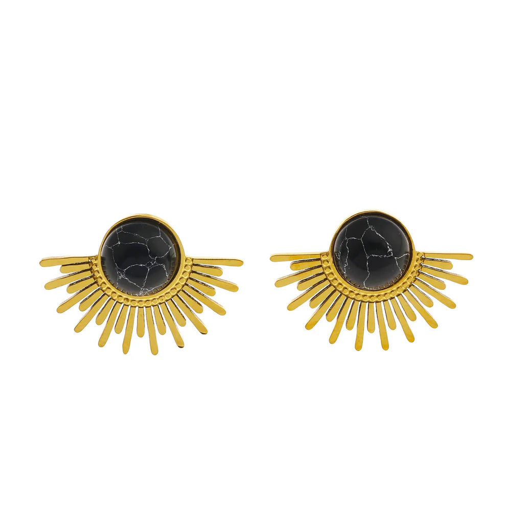The Hackney Nine Lovissa Black/Gold Earrings are inspired by ancient Egyptian style and feature a stunning Lovissa half-sun symbol. These earrings are adorned with natural black stones, adding a touch of elegance to your look. Elevate your outfit with these unique and timeless studs.