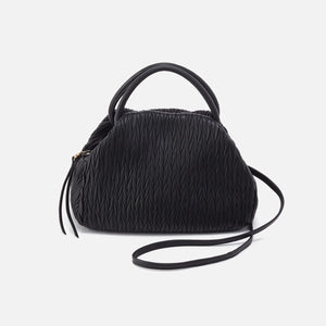 Introducing the most 'darling' bag - the Darling in black. Designed for casual-cool style, this top handle bag comes with a removable crossbody strap for convenient, hands-free wear. Perfect for both day and night, this bag is as versatile as it is stylish.