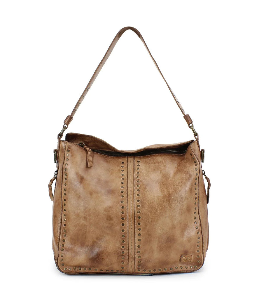 Introducing the Bed Stu Packet LTC. This shoulder tote bag is adorned with metal studs for an edgy touch.  The outer zippered pocket adds convenience and security. Made from rich textured leather, this bag will be a great addition to your outings.;