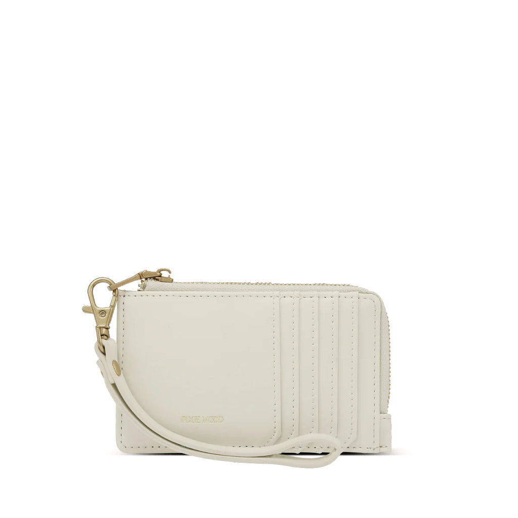 The Pixie Mood Quinn card holder features a slim profile with five card slots and a zip-around coin compartment. For added convenience, it now includes a wristlet strap for easy carrying. Keep your essentials organized and accessible with this stylish and functional wallet.