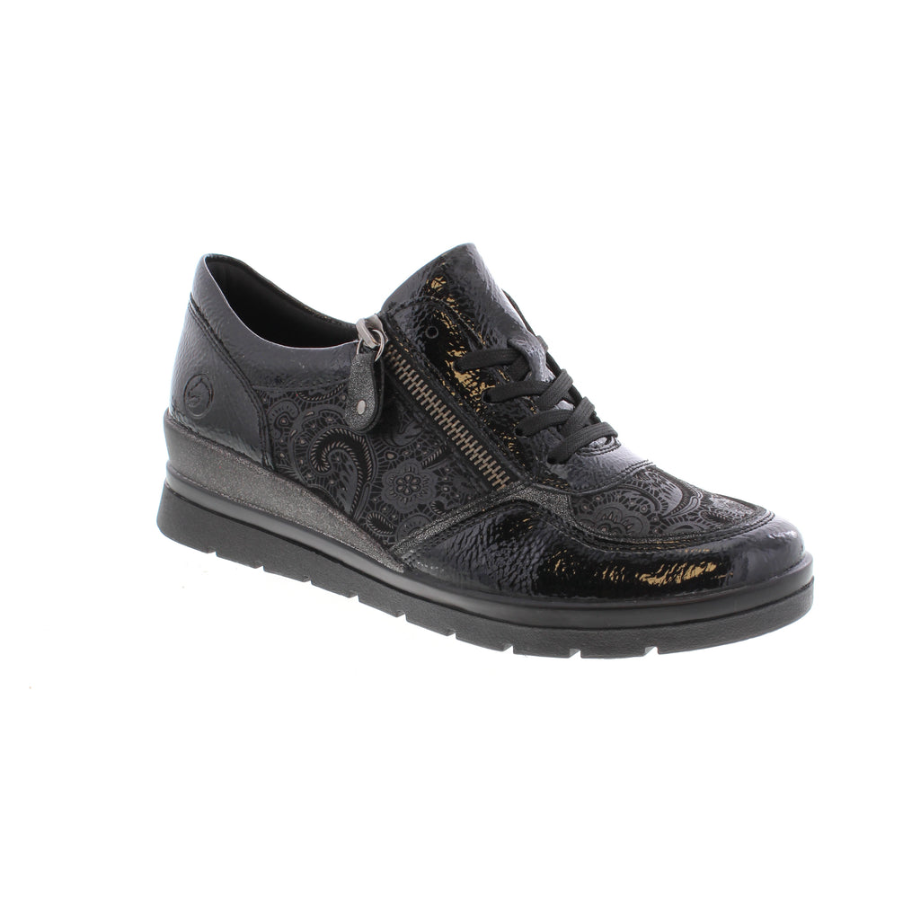 Crafted from premium leather and synthetic materials, the Remonte R0701-03 offers durability and style. Its manmade lining and quilted leather removable insole provide comfort and breathability, while the rubber outsole ensures reliable traction. Featuring a 44 mm heel, this shoe balances elegance with support. The lace and zipper combination allows for easy adjustment and a secure fit.