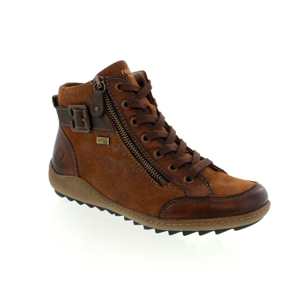 Experience the perfect blend of comfort and style with the Remonte R1441-24 brown lace-up boots. Crafted from suede leather, these boots feature both lacing and a zipper for secure support and easy wear. The water-repellent upper keeps your feet dry, while the grippy, flexible sole ensures confident steps. Enjoy added comfort with a padded, removable insole and a roomy forefoot thanks to the comfort width design. A must-have for your shoe collection that combines practicality with elegant design.
