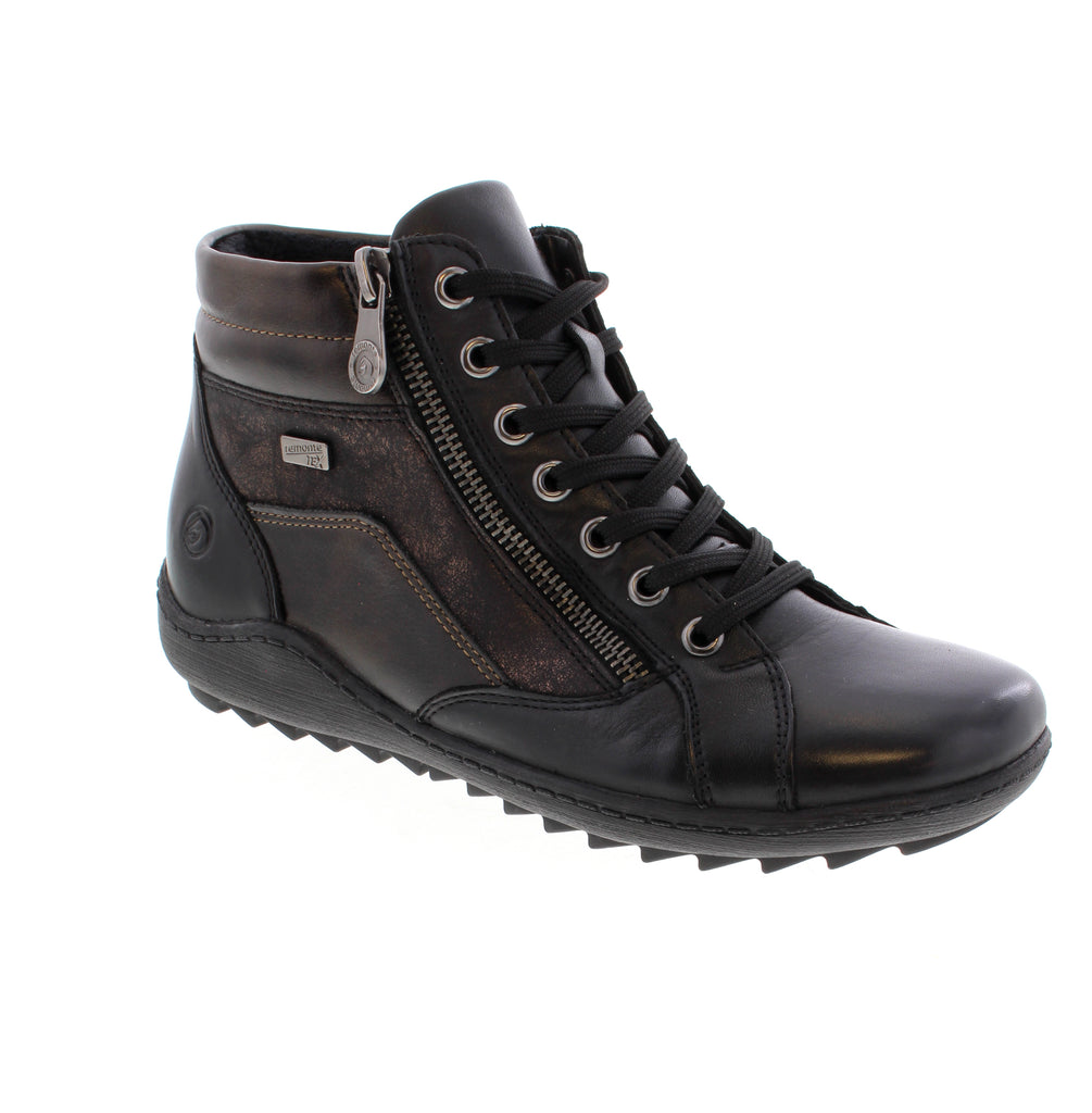 The Remonte R1458 in Black Multi combines functional design with comfort. Crafted with a water-resistant leather upper, this insulated ankle boot offers reliable protection in wet conditions. Featuring both laces and a side zipper, it ensures a customized fit while being orthotic friendly for added support throughout your day. Ideal for those seeking durable and stylish footwear with practical features. 