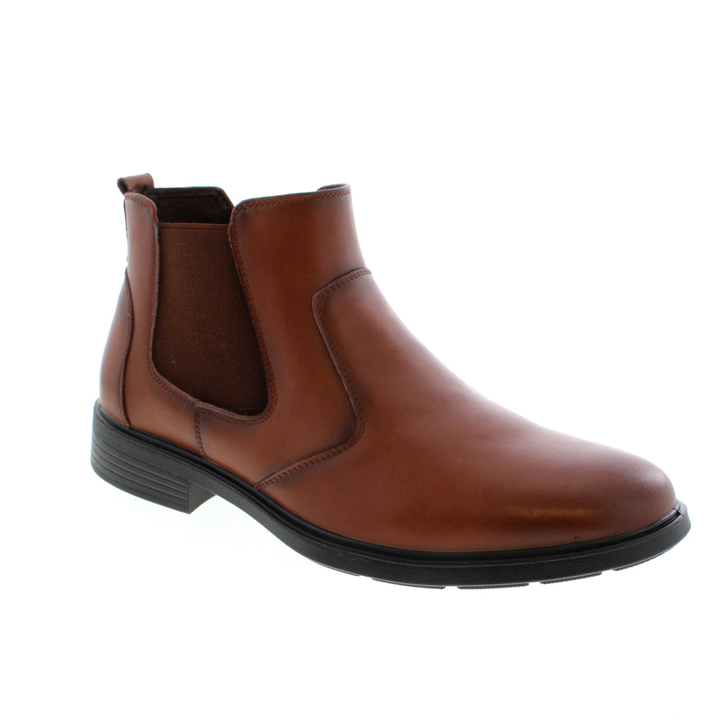 Classic Tan Chelsea boot designed for versatile everyday wear. Features a leather upper with a comfortable foam midsole and rubber outsole for reliable traction. Leather upper with man-made leather lining and removable insole for customizable comfort. Pull-on design with elasticized upper for easy on-and-off. Orthotic friendly construction supports all-day wear. Fits true to size with average width and instep. Block heel under 1" provides subtle lift without sacrificing stability. 