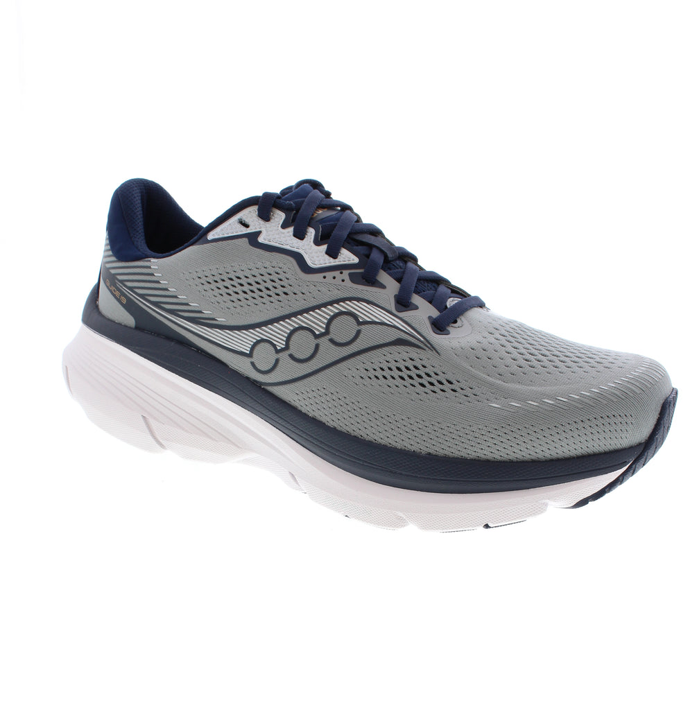 The Saucony Guide 19 S21058-118-S21059-118-S21060-118 in grey and navy supports active pursuits with reliable performance. Built with a breathable mesh upper and lining, this shoe features a removable microfiber footbed compatible with orthotics and light arch support for stability. The rocker bottom heel and padded collar enhance comfort during walking and road running.