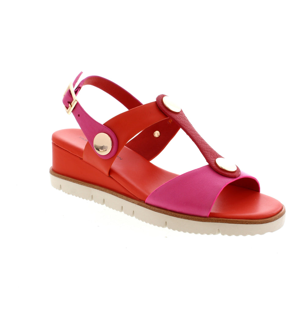 Elevate your style with the Tamara London Sabati wedge sandals. Featuring an adjustable backstrap, these sandals offer both security and sophistication. Make a statement at any occasion with these stylish and eye-catching sandals.