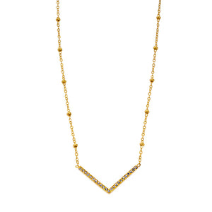 This artisanal Hackney Nine Sanita necklace combines elegance and contemporary design. The 'V' shaped pendant sparkles with zirconia gemstones, while the beads on the dainty chain reflect the light with every movement. Made from premium base metal, this necklace is layered with 18 karat pure gold and silver for a luxurious touch.