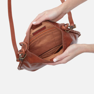 Expertly crafted with a chic design and spacious interior, the Hobo Bags Phoebe Bag is the perfect tote for everyday use. With enough room for your laptop and more, this bag is both stylish and functional. 