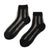 Inspired by heritage textile trimmings, the Unified Sheer Ribbon sock features a graceful rick-rack patterned weave in clean vertical lines. This structured yet feminine detail balances airy transparency with tactile texture nostalgic and fresh. The shorter, modern silhouette offers a secure, comfortable fit with a clean-finished edge and reinforced cotton-blend heel and toe for durability. Exclusively in classic black, it's a sophisticated statement piece perfect for sharp loafers or minimalist heels.