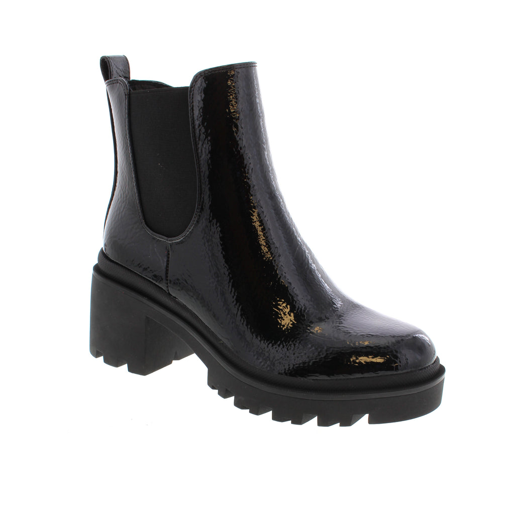The Aqua Flex Slick One boots in black seamlessly blend style and comfort. Featuring a sleek patent leather upper, these boots add a polished and contemporary touch to any outfit. The side zipper and elastic gore panel provide effortless slip-on convenience, making them easy to wear throughout your busy day. Inside, a cushioned interior ensures lasting comfort, supporting your feet whether you're on the move or standing for long periods. 