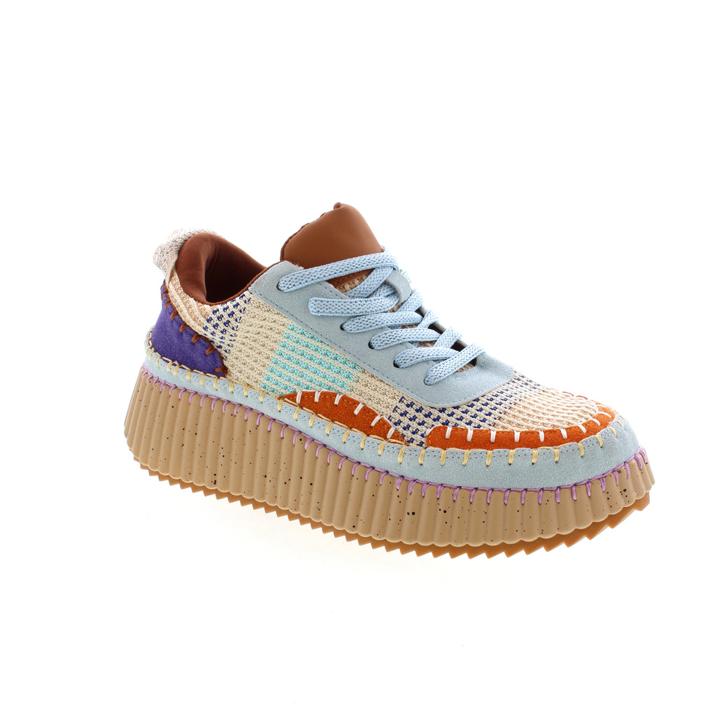 Tyche's beautiful platform sneaker with patchwork design is a show stopper. 