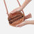 Get ready to hit the road in style with our Nash crossbody bag! This compact and trendy bag, featuring a playful fringe tassel, is a must-have for travellers, urban nomads, festival-goers, and minimalists alike. With its iconic HOBO design and cork material, it's the perfect combination of cool and practical.