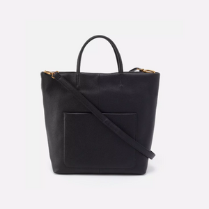 The Hobo Bags Tripp - is the ultimate tote - perfect for everyday use and special occasions alike. It features top handles, exterior slip pockets, a removable strap, and a roomy interior; all seamlessly merging modern design with practical convenience. Effortlessly transition from day to night with style and ease!