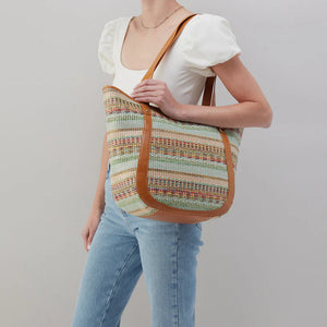 The Hobo Bags Sonder - Sea Dream. Prepare for endless compliments when you carry the Hobo Bags Sonder. This playful and unique design fits all of your belongings. Say goodbye to boring bags and hello to a sea of curious compliments!