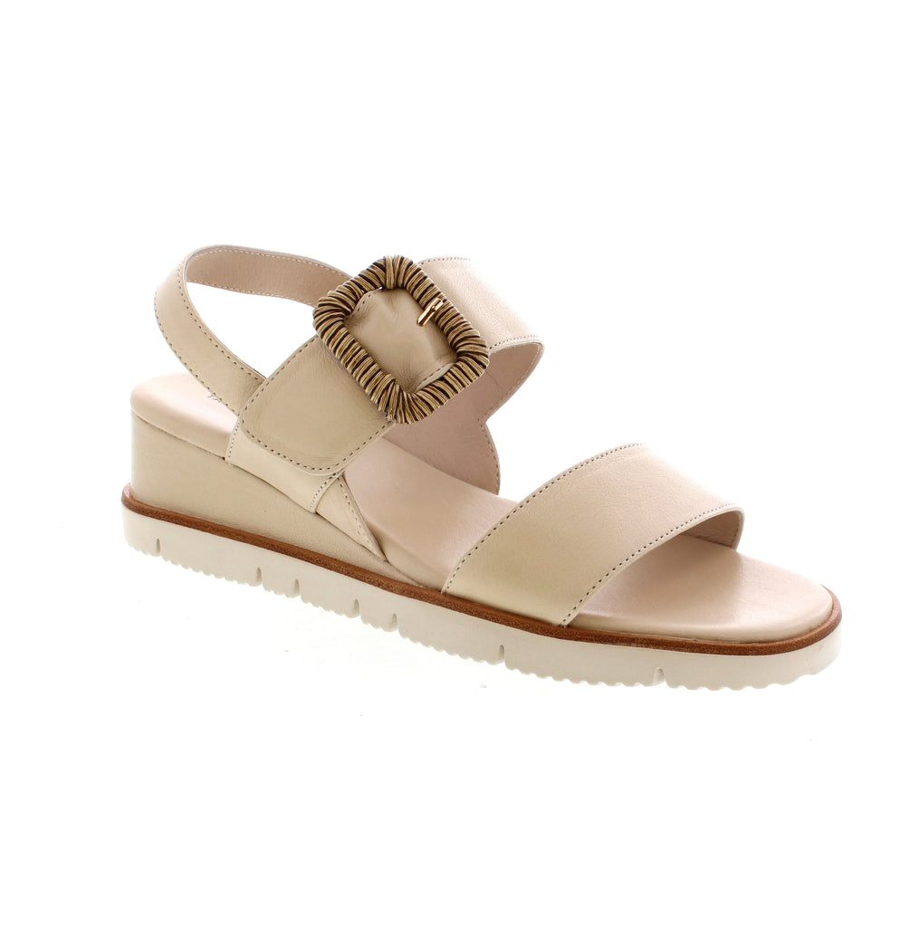 Take your style to new heights with Tamara London Stylo wedge sandals. Adjustable backstrap and large buckle provide security and sophistication. Perfect for making a statement at any occasion with these stylish and eye-catching sandals.
