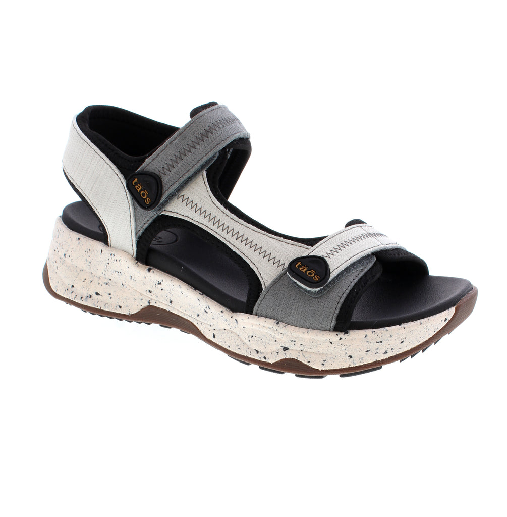 The Taos Super Side sandal in grey multi is built for outdoor exploration. Featuring an anatomical Structured Support footbed, this water-friendly design delivers comfort for walking and hiking. The lightweight construction pairs with an energy-return midsole and all-terrain rubber outsole for durability on any surface.