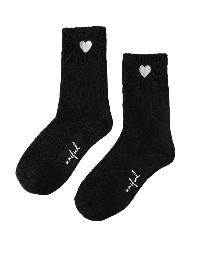 Our beloved Sweater Sock gets a romantic upgrade with an extended fit and charming embroidered heart detail. Luxuriously soft and toasty warm, this elevated version delivers the same signature wide-ribbed comfort while hugging your feet in plush perfection. The added length makes it ideal for layering with your favorite boots or enjoying during cozy downtime.