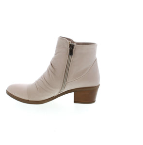 Experience elevated fashion with Everly Talia ankle boots. Featuring unique ruching detail and a convenient side zipper, these boots bring a touch of sophistication to any outfit. 