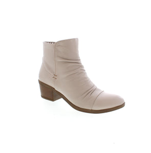 Experience elevated fashion with Everly Talia ankle boots. Featuring unique ruching detail and a convenient side zipper, these boots bring a touch of sophistication to any outfit. 