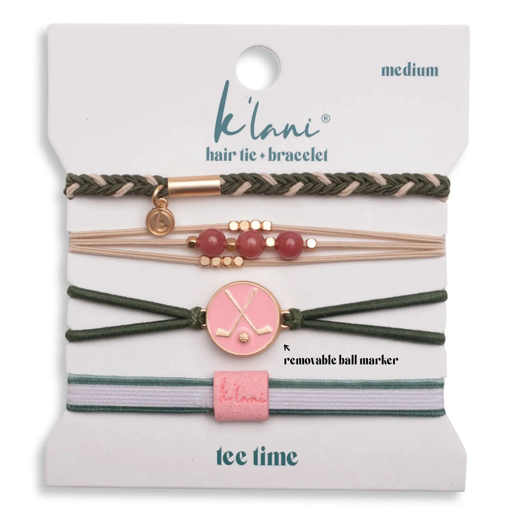 The K'lani Tee Time pairs style with function. This 4-piece hair tie bracelet collection features soft greens and pinks with natural stone, gold, and pearl accents. The standout feature is a removable charm that works as a golf ball marker—perfect for golfers who want to look good on and off the course. Fully adjustable with pull ties on the back for a custom fit.