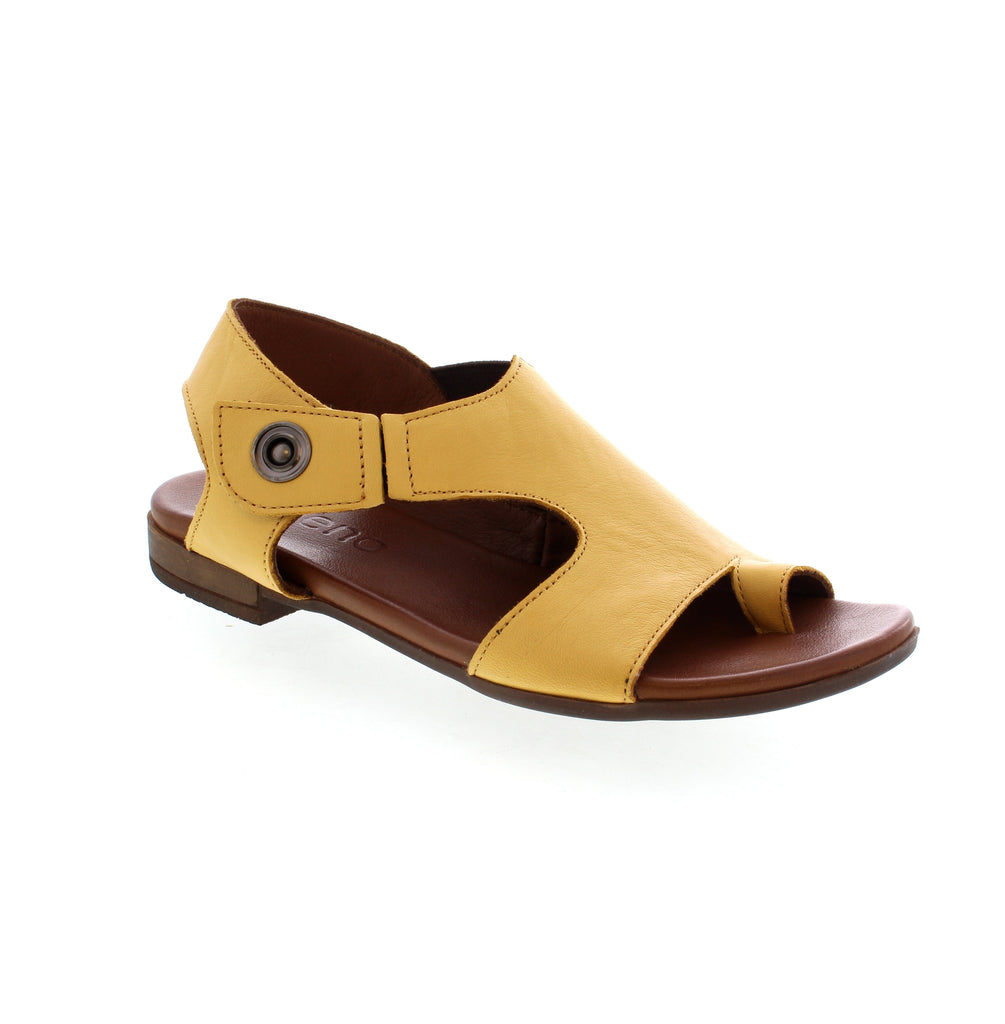 Introducing the Bueno Tessie sandals in a trendy mustard hue. These flats embrace casual comfort with a breathable cutout design and adjustable strap for a secure, custom fit. The cushioned footbed ensures all-day comfort, making them perfect for any summer occasion.