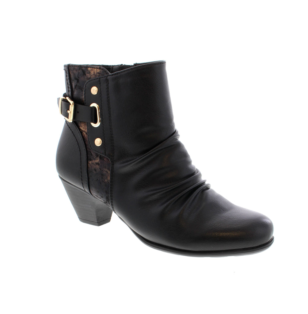 Put a playful spin on your shoe game with the Taxi Vienna-03 in Black Multi! Crafted with a sleek man-made leather upper and a convenient side zip entry, these booties are as easy to wear as they are stylish. The block heel offers just the right amount of lift to keep you dancing or strolling with confidence all day long. Step lively and stand out in these fun, fashionable kicks!