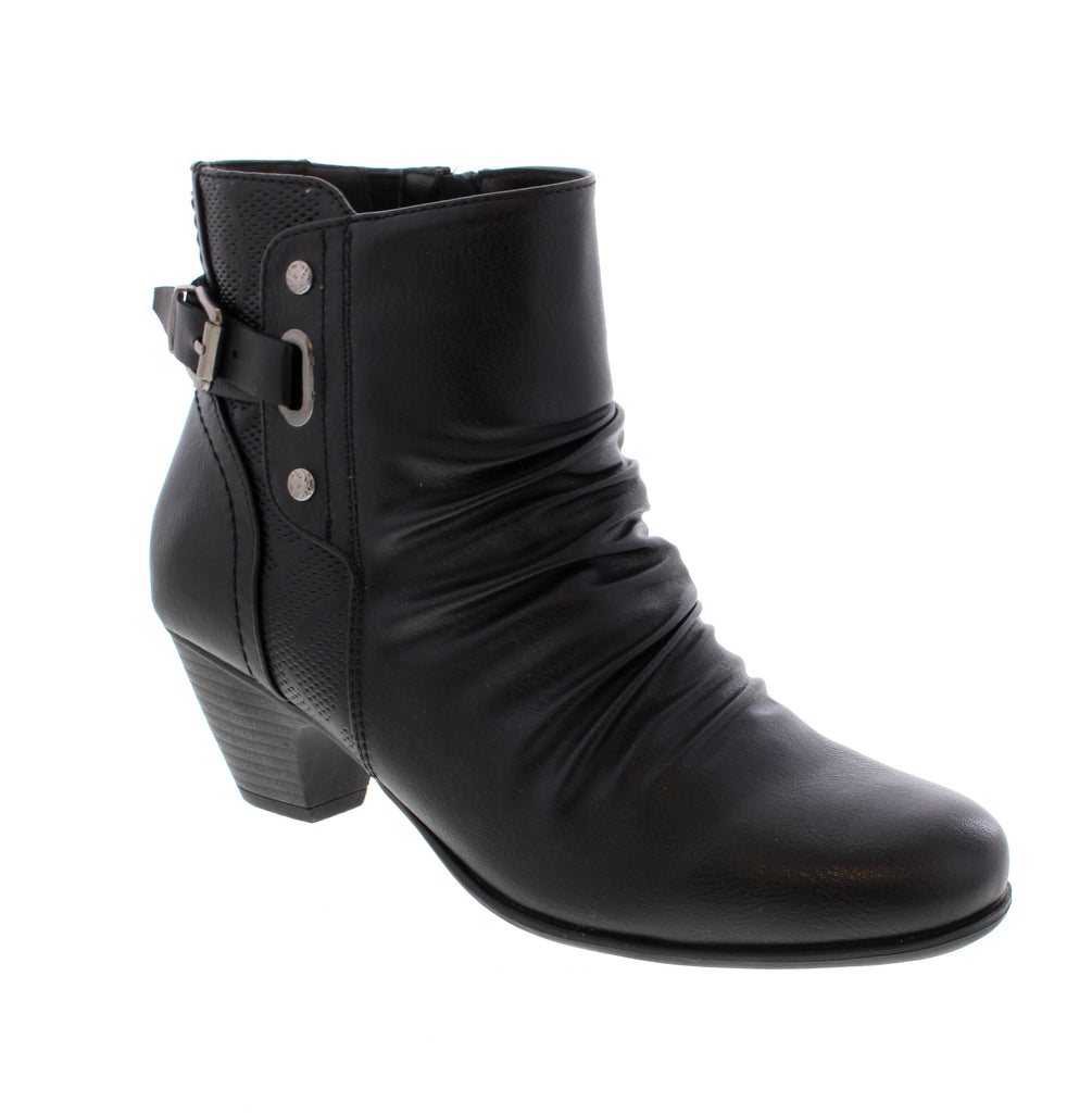 Put a playful spin on your shoe game with the Taxi Vienna-03 in Black! Crafted with a sleek man-made leather upper and a convenient side zip entry, these booties are as easy to wear as they are stylish. The block heel offers just the right amount of lift to keep you dancing or strolling with confidence all day long. Step lively and stand out in these fun, fashionable boots!