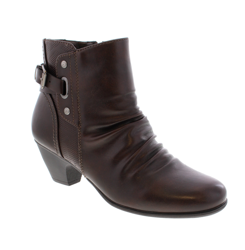 Put a playful spin on your shoe game with the Taxi Vienna-03 in Brown! Crafted with a sleek man-made leather upper and a convenient side zip entry, these booties are as easy to wear as they are stylish. The block heel offers just the right amount of lift to keep you dancing or strolling with confidence all day long. Step lively and stand out in these fun, fashionable boots!
