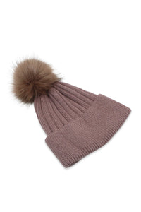 Upgrade your winter wardrobe with the Morgan & Taylor Remi Beanie in Brown. Made from a warm wool-blend, this classic silhouette features ribbed detailing and a cute faux fur pom-pom. Perfect for staying cozy and stylish all winter long.