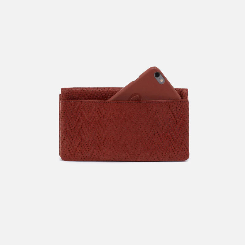 The Hobo Bags Lumen Wallet is expertly crafted for both style and functionality. The exterior features a convenient pocket with a leather tassel zipper pull and a slip pocket for your phone. The interior is thoughtfully designed to hold all of your wallet essentials.