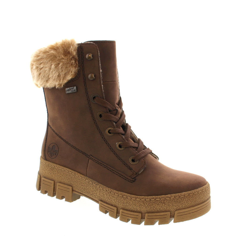 Discover comfort and style with the Rieker Y0230-24 in Tan. This women's ankle boot features a water-resistant faux leather upper with a cozy faux fur collar, perfect for fall and winter seasons. The round toe silhouette sits atop a platform heel under 1" for subtle lift, while the side-zip and lace-up closures ensure a secure fit. Inside, a removable microfiber insole and foam midsole provide cushioning support, with orthotic-friendly construction for all-day wear. 