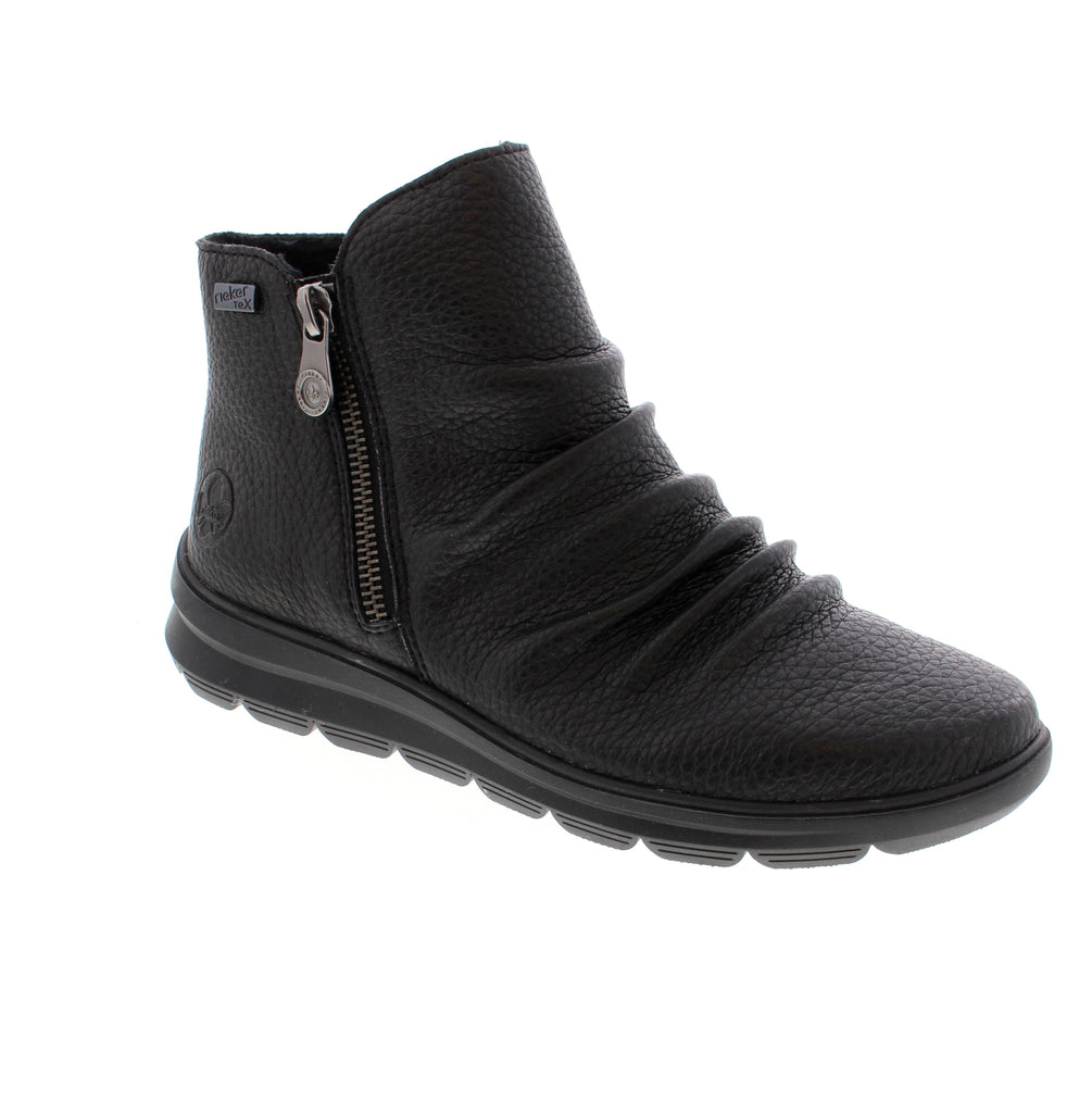Step confidently in the Rieker Z0056-00 ankle boots, crafted from smooth leather for timeless style and lasting comfort. Featuring a convenient zipper for easy wear, these boots offer a grippy sole for stable footing in any condition. Stay dry with the water-repellent membrane, while the soft velour lining and padded, removable insole keep your feet warm and comfortable all day long. Perfect for any season, these boots combine practicality with classic elegance.