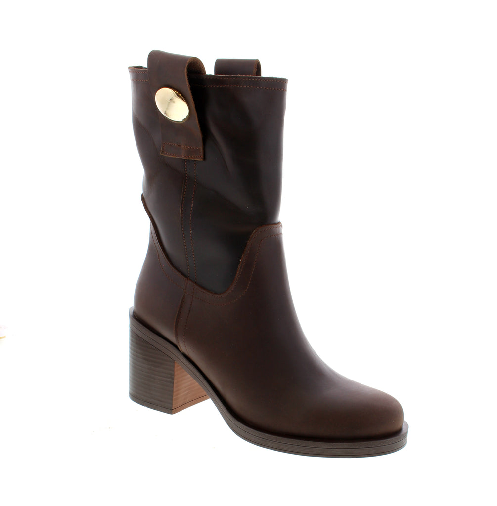 The Bueno Zuri in Brown is a versatile ankle boot designed for everyday wear and professional settings. Crafted with a leather upper, lining, and footbed, this pull-on style combines comfort with timeless appeal. Featuring a foam midsole and durable rubber outsole, the Zuri delivers reliable support throughout your day. The stacked heel and round toe create a classic silhouette that pairs effortlessly with casual or office-appropriate outfits