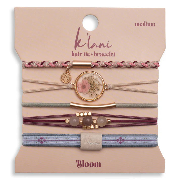 The K'lani Bloom hair tie/bracelets will be the perfect floral touch to your hair or wrist. A great accessory to have with you this spring and summer!