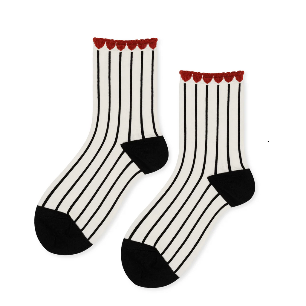 Discover the charm of the Hansel From Basel Tulip Top Crew Socks in classic black, featuring a delightful tulip detail at the cuff. Crafted from soft, combed cotton, these socks offer exceptional comfort and durability. The subtle tulip design adds a touch of whimsy and personality, perfect for brightening your everyday wear. Ideal for pairing with casual shoes or dressing up a simple outfit, these socks combine style and coziness effortlessly. 