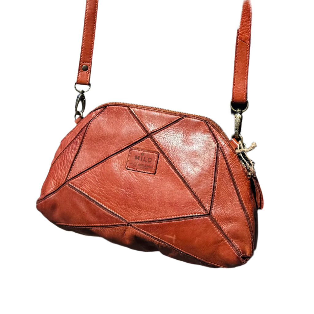 The Milo Bianca crossbody bag is precisely crafted to securely carry all your essentials. Offering ample storage and several compartments, it keeps your belongings well-organized, making it a valuable addition to your wardrobe.