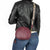 Upgrade your style with the Remonte Bag Q0634 in a trendy burgundy color. With three spacious pockets and additional zipper pockets, this bag is both stylish and practical. The detachable boho-patterned shoulder strap adds a unique touch. Stay organized and on-trend with this versatile shoulder bag.
