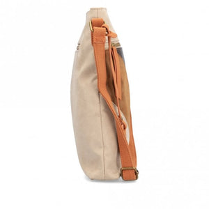 As a classic bag with a metallic touch, the Remonte Bag Q0714-60 in cream multi is as stylish as it is practical. Featuring exterior and interior pockets with zippers, it's perfect for storing all your essentials and keeping them organized. Plus, its neutral color ensures it will seamlessly match any outfit.