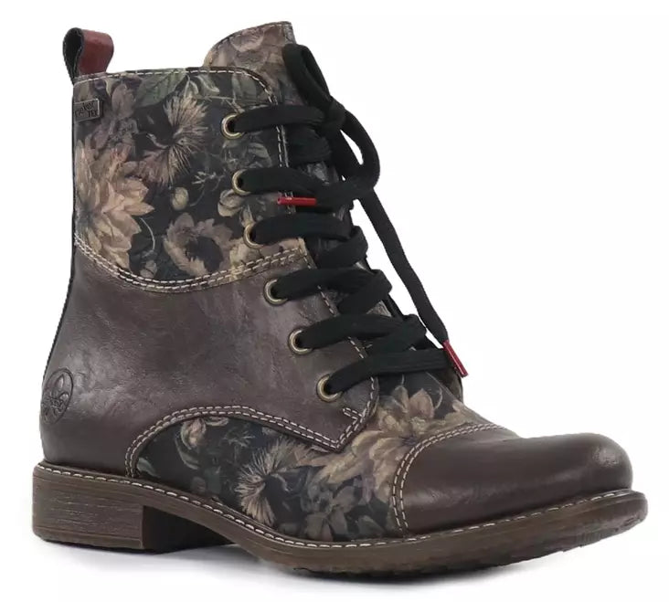 Effortless style meets everyday comfort in the Rieker 74800-25. This versatile brown print ankle boot combines a sleek almond toe silhouette with practical features designed for all-day wear. Leather upper with water-resistant protection keeps your feet dry in light moisture. The removable microfiber footbed and foam midsole deliver cushioning support, while the rubber outsole provides reliable traction. Lace-up entry ensures a secure, customizable fit.