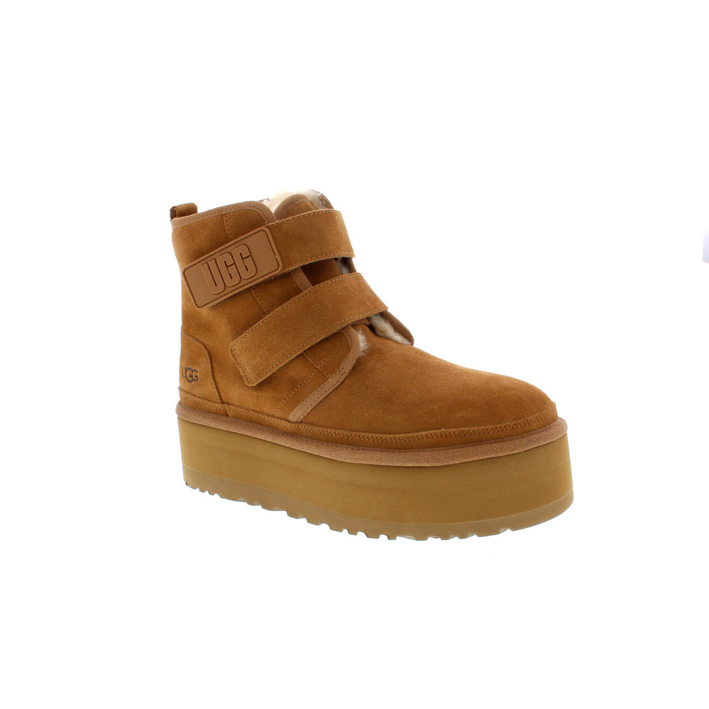 UGG Neumel Platform boot features a platform outsole and a front-zip entry for easy on and off. Crafted in rich suede and lined in sheepskin with an UGGplush insole to keep your feet warm and supported. 