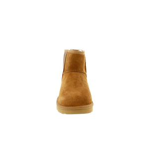 The UGG Classic Mini Side Logo II boot features a soft sheepskin interior, a side UGG logo, and a lightweight sole for cushioning and traction.